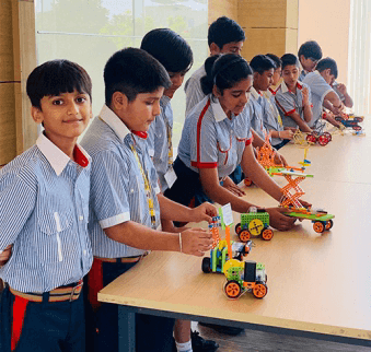 School students demonstrating robotics at a STEM exhibition