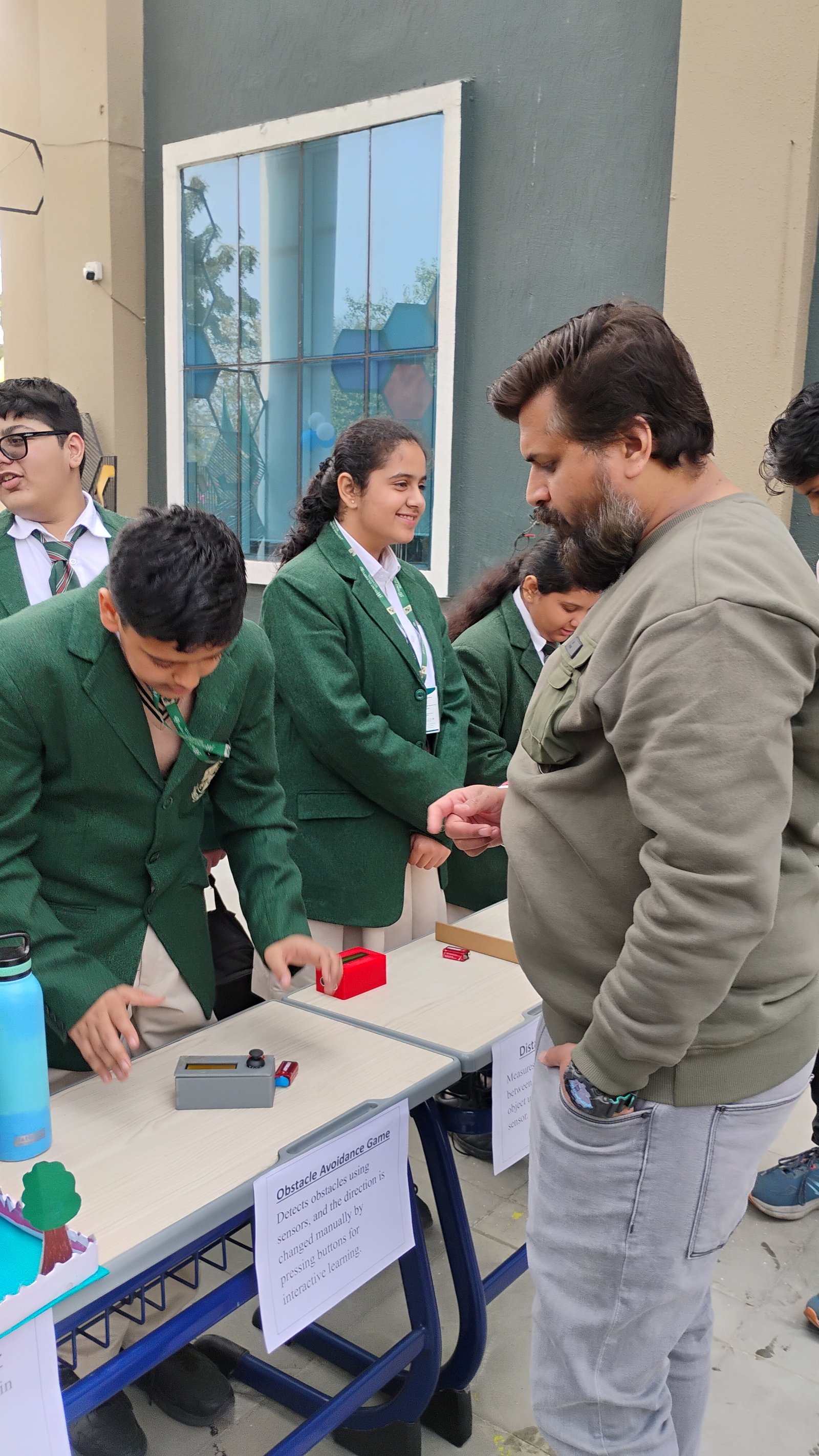 Indian students developing an innovation prototype using robotics and electronics in an Atal Tinkering Lab school environment