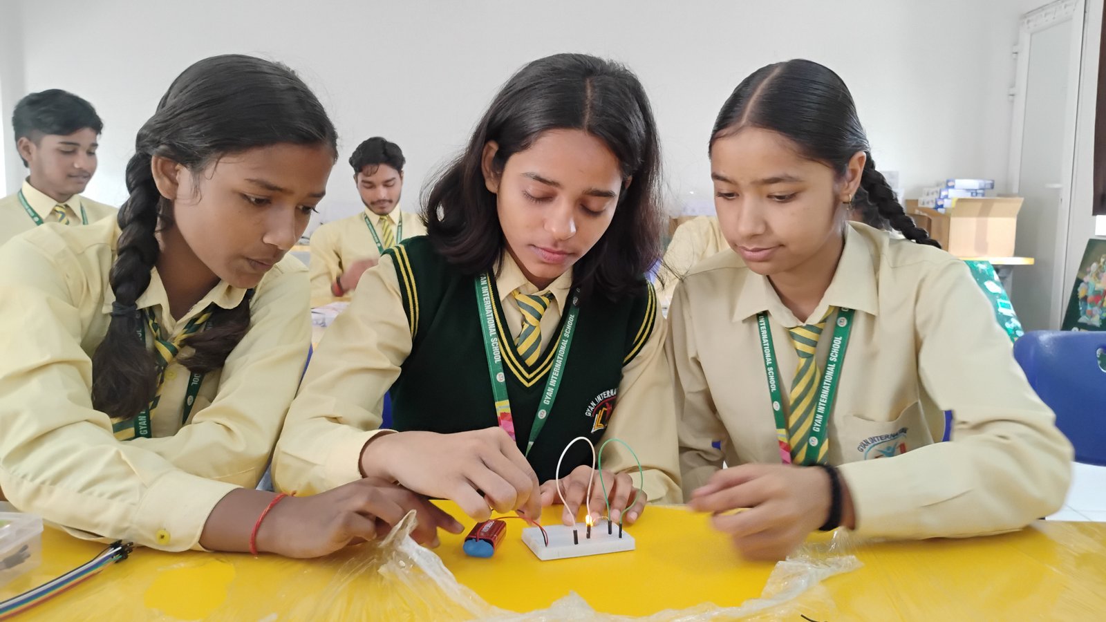 Indian middle-school students collaboratively building a robotic prototype in a STEAMverse STEM and STEAM innovation lab